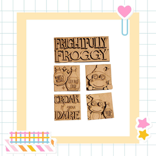 a collection of four wooden blocks with various text and designs on them, arranged in a frame.