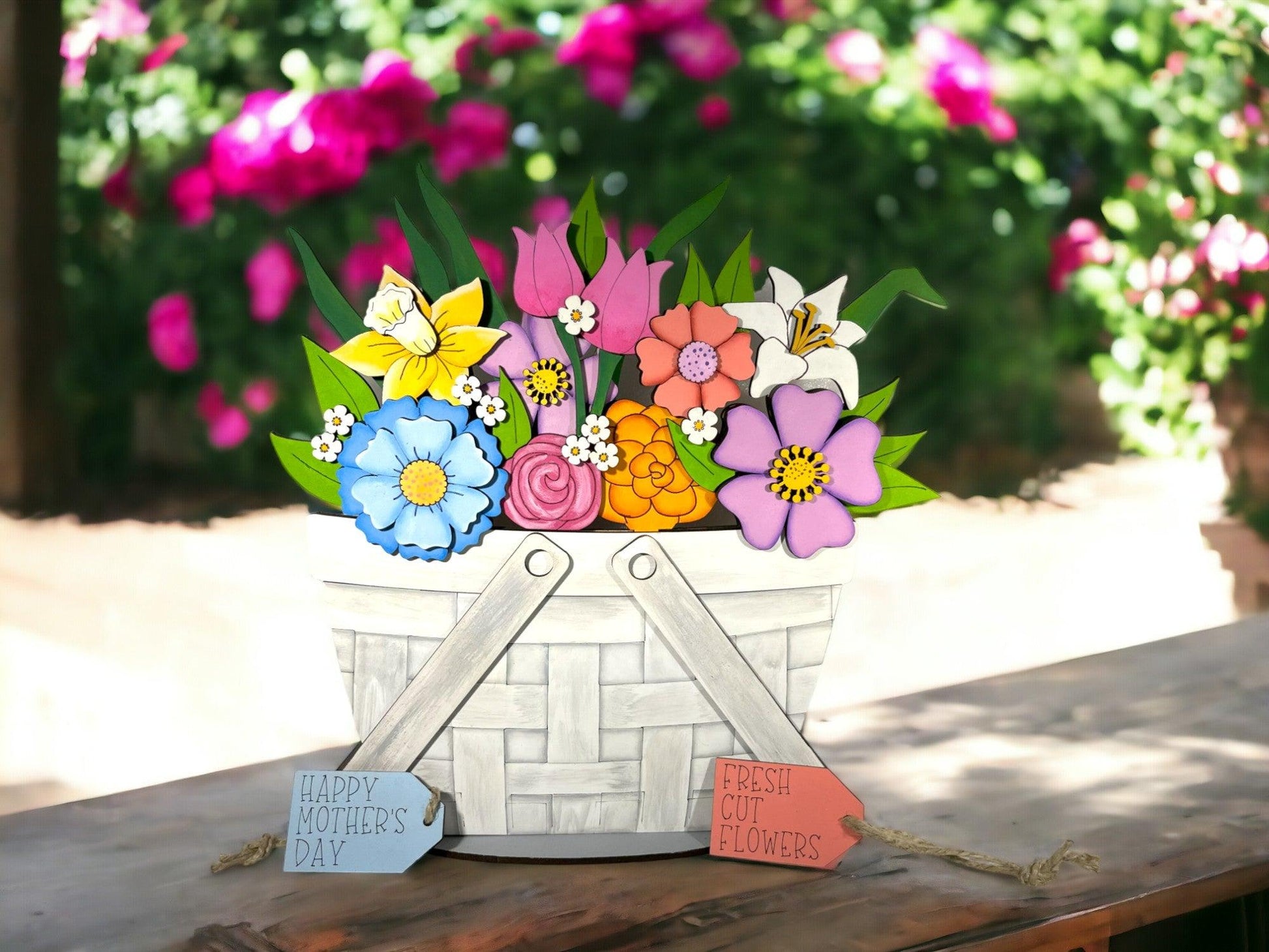 a basket of flowers sitting on a wooden table