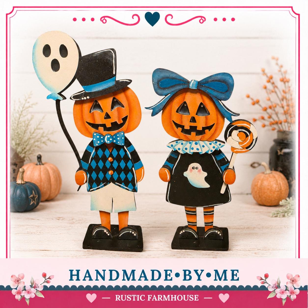 two wooden Halloween figurines, a pumpkin and a ghost, standing on a wooden surface. The pumpkin is wearing a top hat and a bow tie, while the ghost is holding a lollipop. The background includes pumpkins and a vase with flowers, creating a festive Halloween atmosphere.