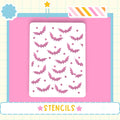 a white stencil with a pattern of pink bats on a pink background.