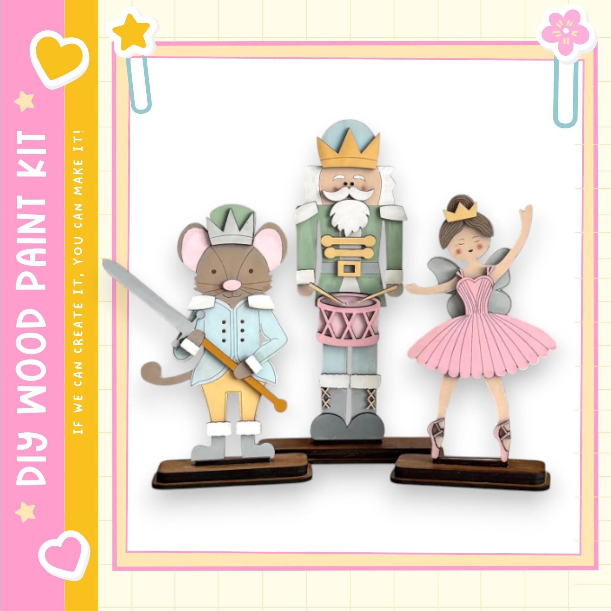 A wooden paint kit depicting a nutcracker, a mouse, and a ballerina, with a pink and yellow border.