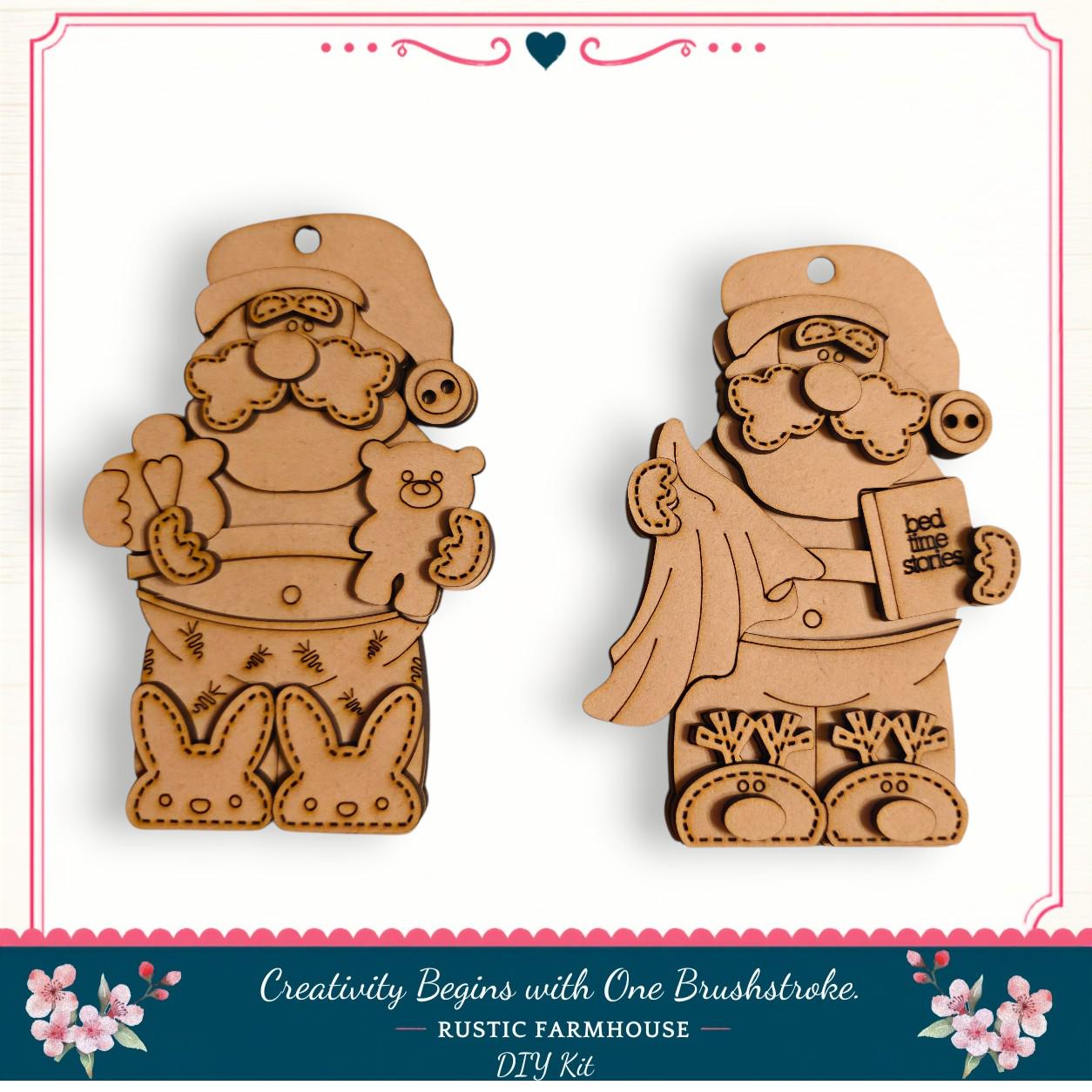 two wooden ornaments, each depicting a different Santa Claus character. The ornaments are designed to resemble Santa Claus holding a teddy bear and a book, with the text "Creativity Begins with One Brushstroke. Rustic Farmhouse DIY Kit" visible.