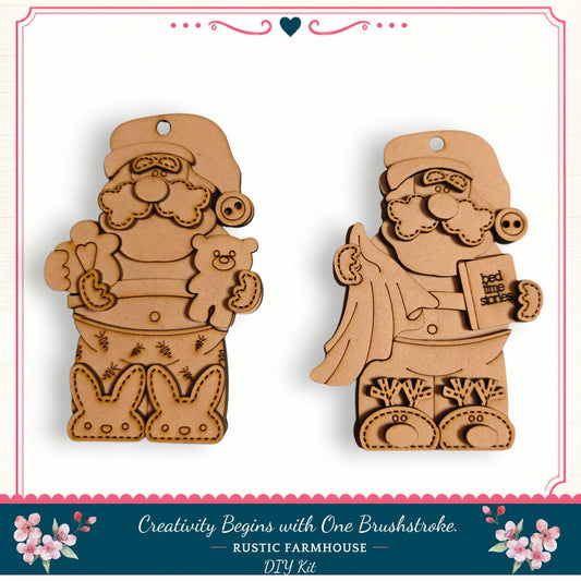 two wooden ornaments, each depicting a different Santa Claus character. The ornaments are designed to resemble Santa Claus holding a teddy bear and a book, with the text "Creativity Begins with One Brushstroke. Rustic Farmhouse DIY Kit" visible.