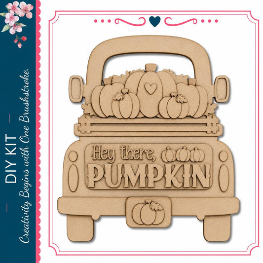 A wooden truck with a decorative pumpkin design on the back.