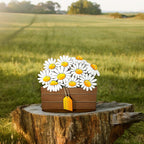 a wooden box with a bunch of daisies in it