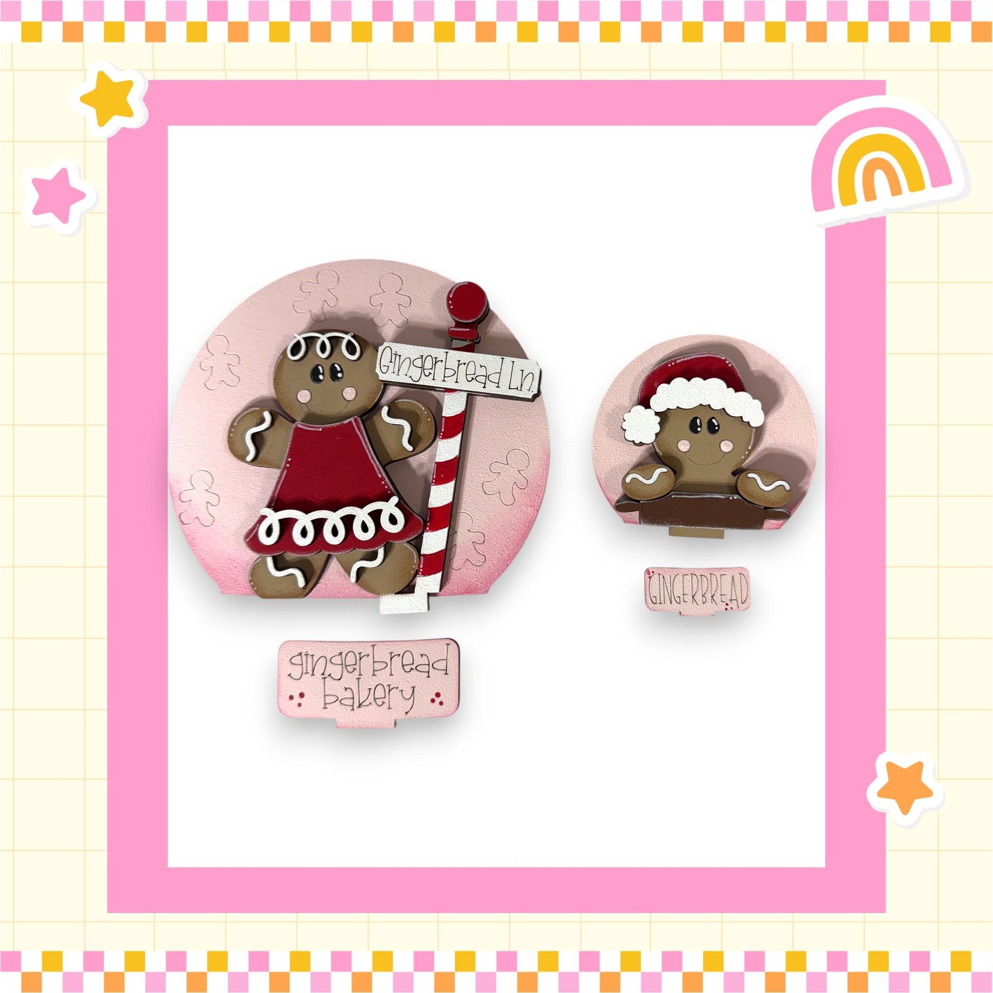 two gingerbread cookies, one larger and one smaller, both wearing festive hats and dressed in red and white outfits. The larger cookie is positioned on the left side of the image, while the smaller cookie is on the right side. The background of the image is pink, and there is a sign that reads "Gingerbread Bakery" in the center.