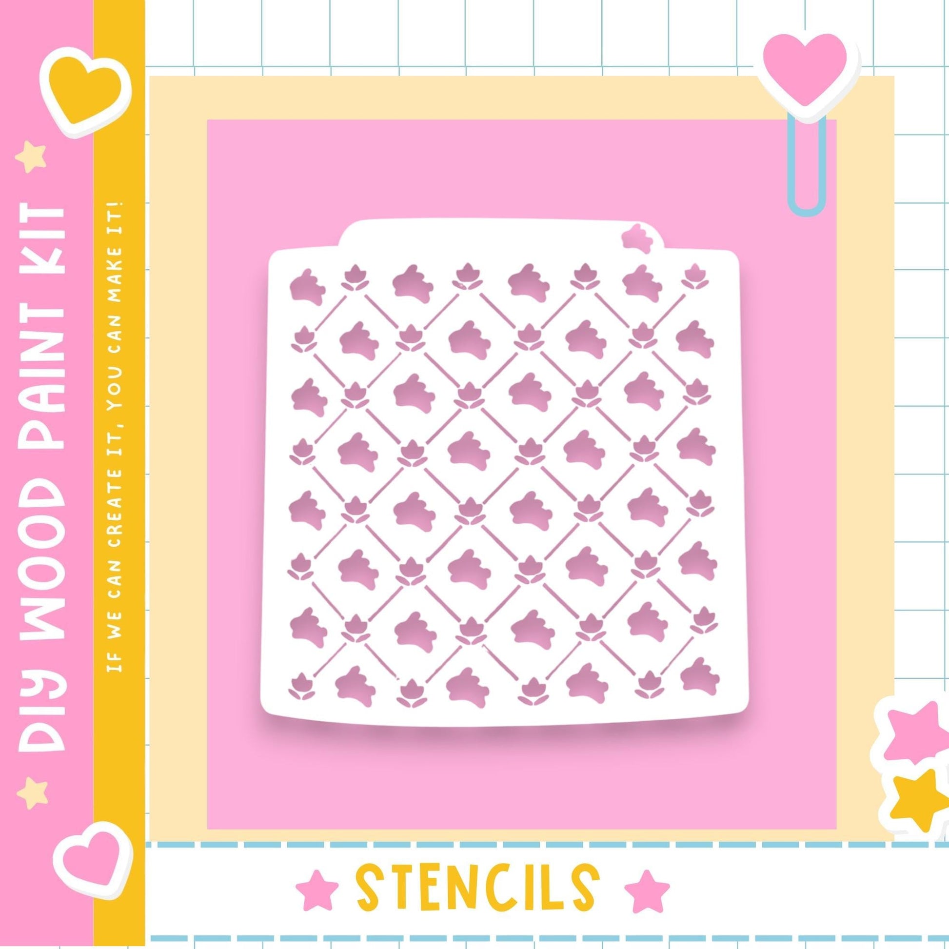 a white stencil with a repeating pattern of pink flowers against a pink background.