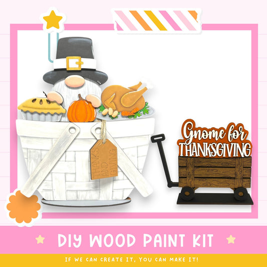 a DIY wood paint kit for creating a Thanksgiving-themed decoration, including a gnome figure, a basket filled with food, and a wooden sign that says "Gnome for Thanksgiving".