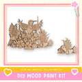 a DIY wood paint kit, with a large wooden bird sculpture and smaller wooden birds displayed in a frame.