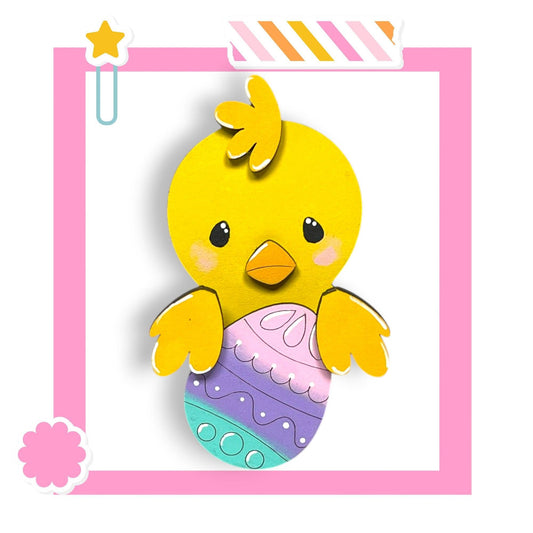 a picture of a yellow bird holding an easter egg