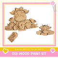 a DIY wood paint kit with a wooden cow and heart-shaped decorations. The kit appears to be made of wood and includes a heart-shaped decoration.