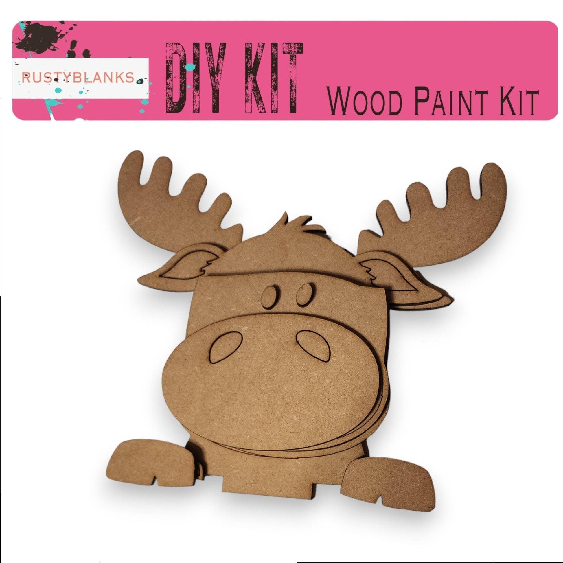 a paper cut out of a moose with a pink background