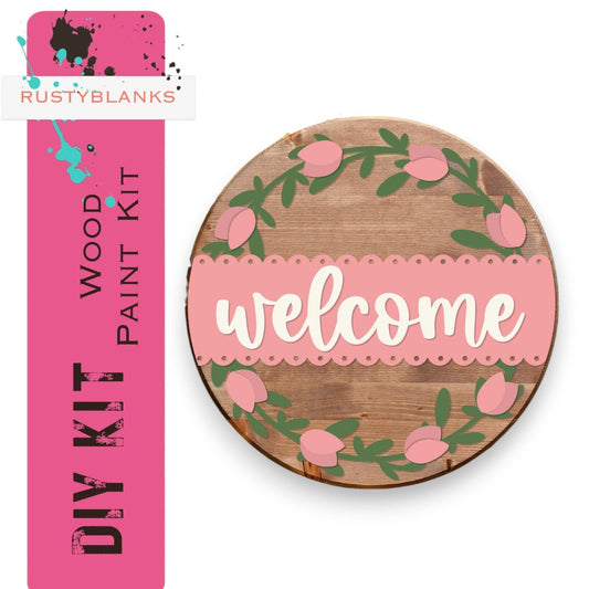 a wooden sign that says welcome with pink flowers