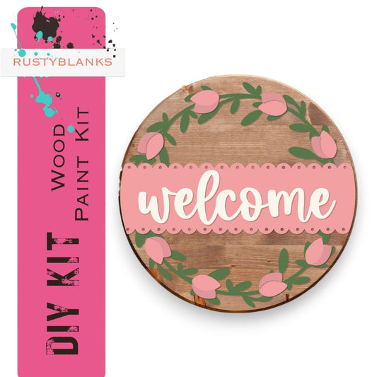 a wooden sign that says welcome with pink flowers