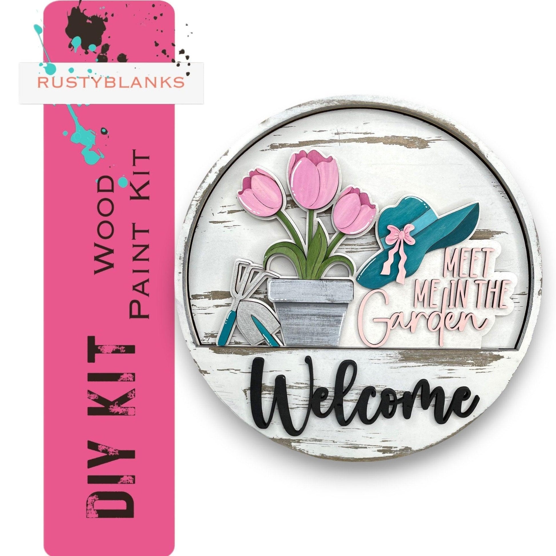 a sign that says welcome with flowers in a pot