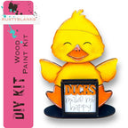a yellow duck holding a sign that says ducks make me happy