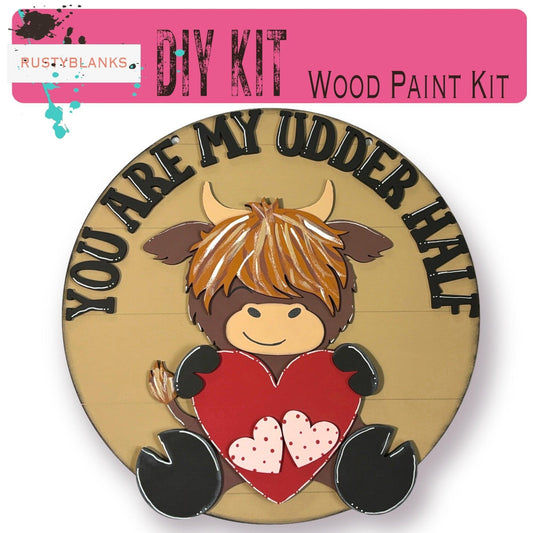 a wooden sign with a cow holding a heart