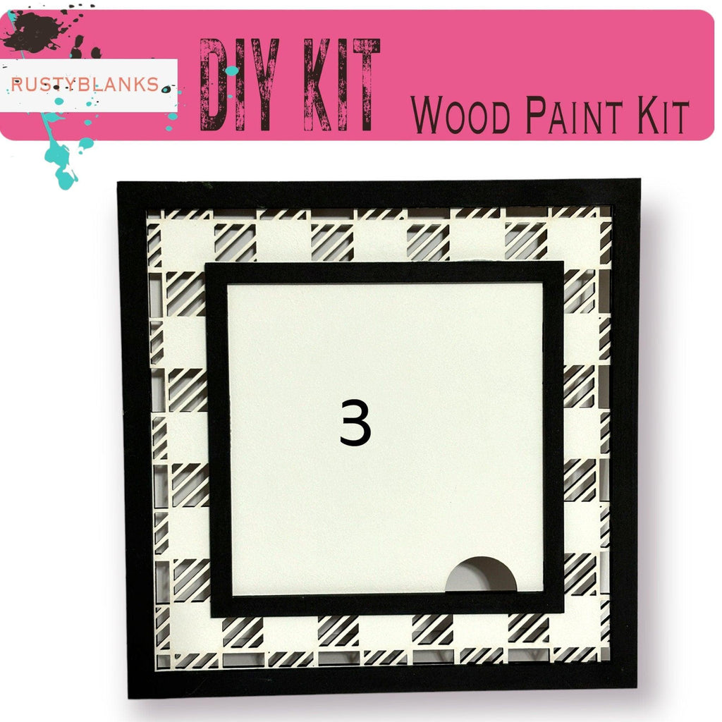 a picture frame with a black and white pattern on it
