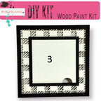 a picture frame with a black and white pattern on it