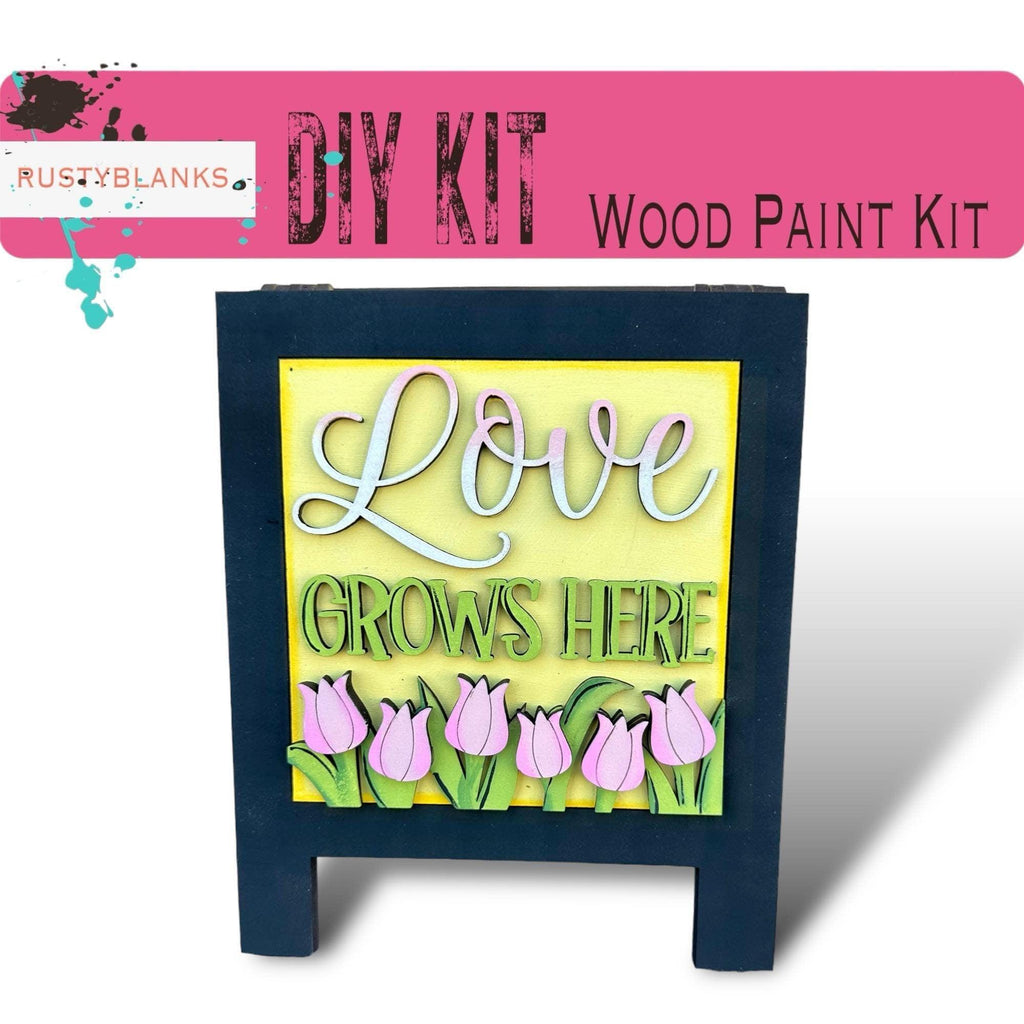 a picture of a sign that says love grows here