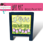 a picture of a sign that says love grows here
