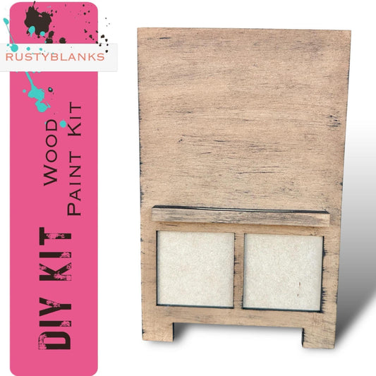 a wooden box with two white squares on it