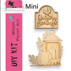 a wooden cutout of a nativity scene