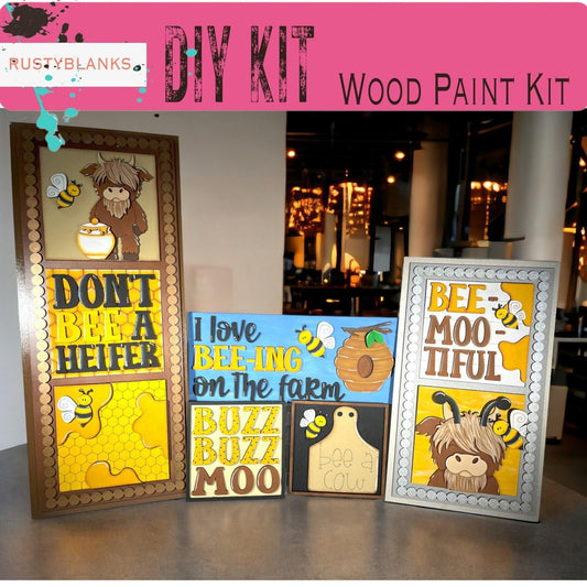 a group of three framed pictures sitting on top of a table