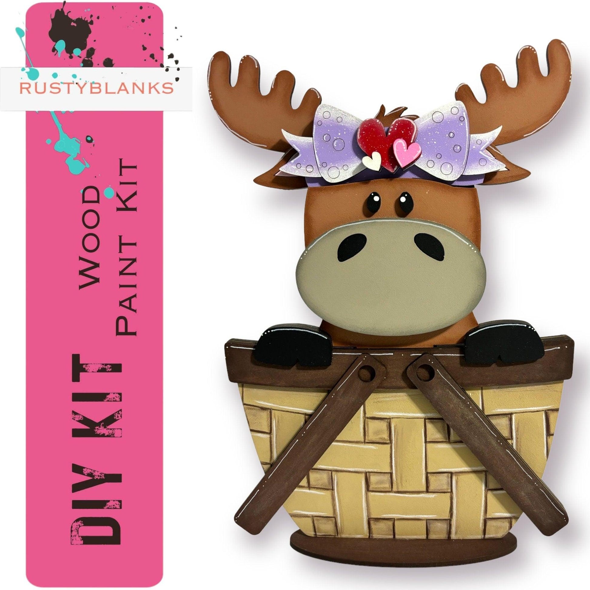 a paper cut out of a moose with a pink background