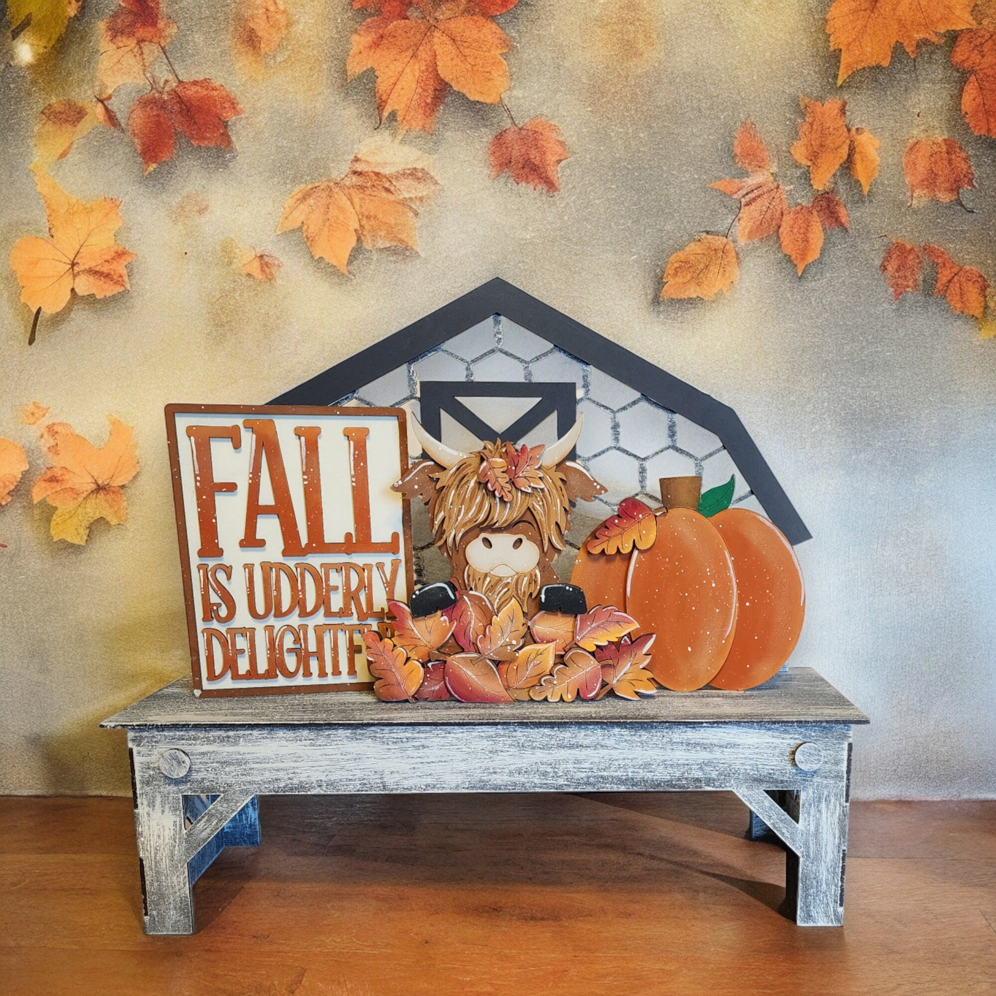 a wooden table topped with a stuffed animal and a sign