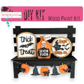 a wooden bench with halloween decorations on it