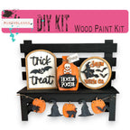 a wooden bench with halloween decorations on it