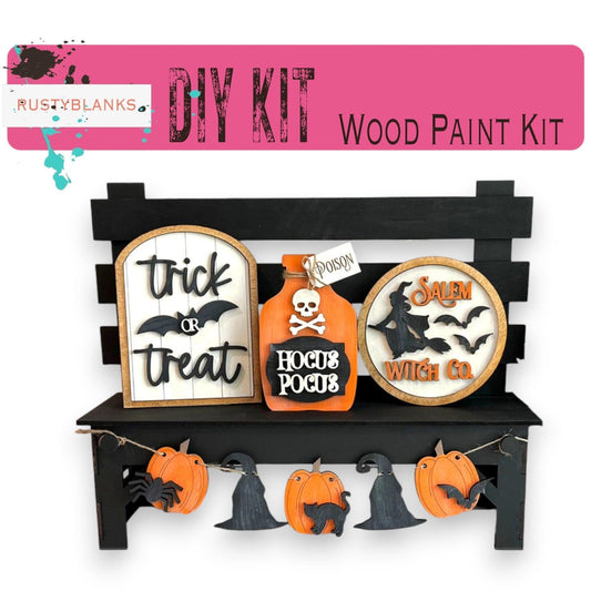 a wooden bench with halloween decorations on it