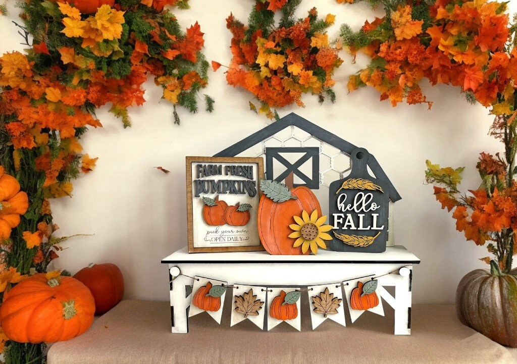 a display of pumpkins and fall decorations