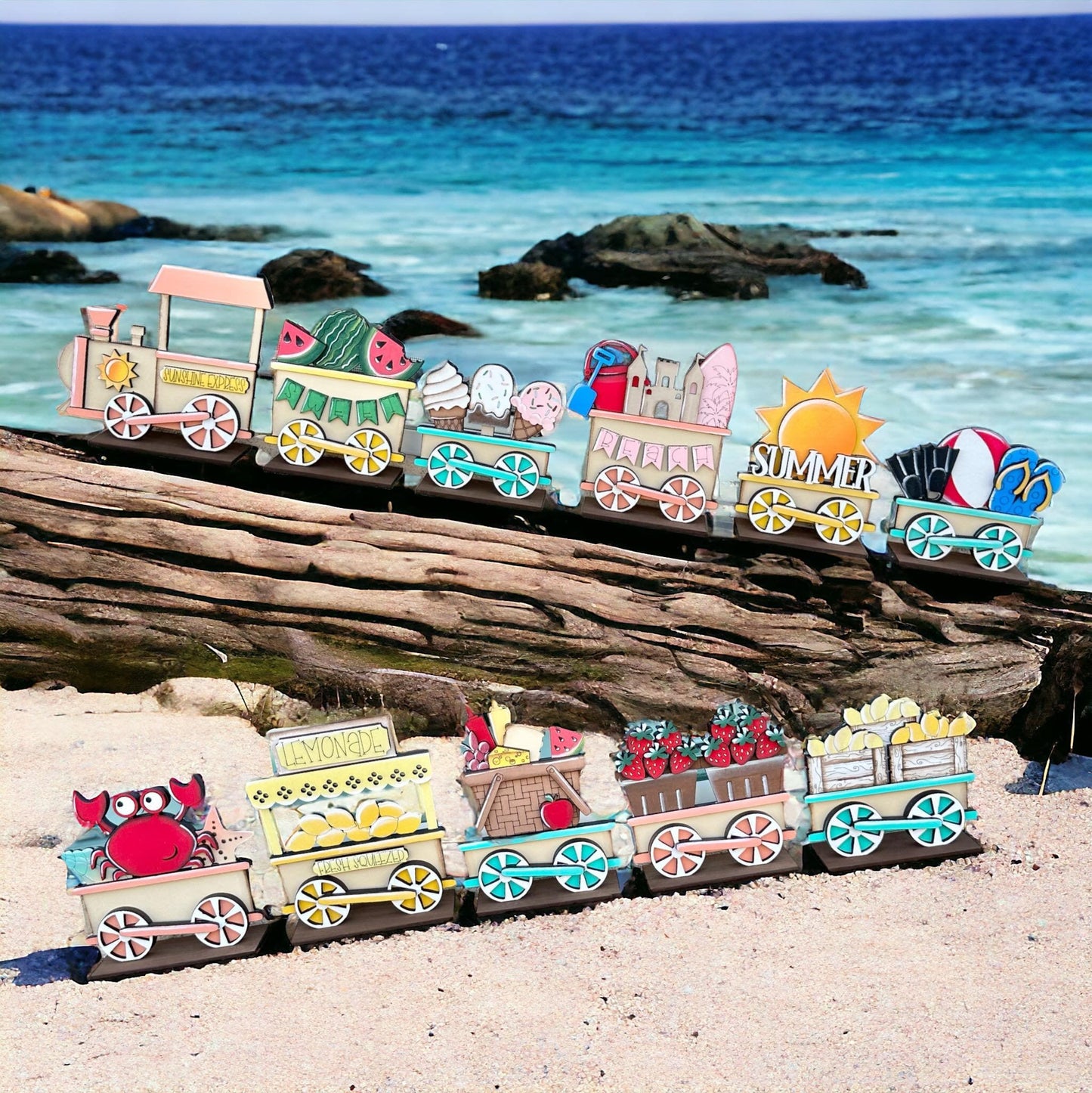 a toy train is sitting on a log on the beach