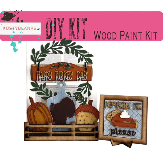 a wooden craft kit with a turkey and pumpkins