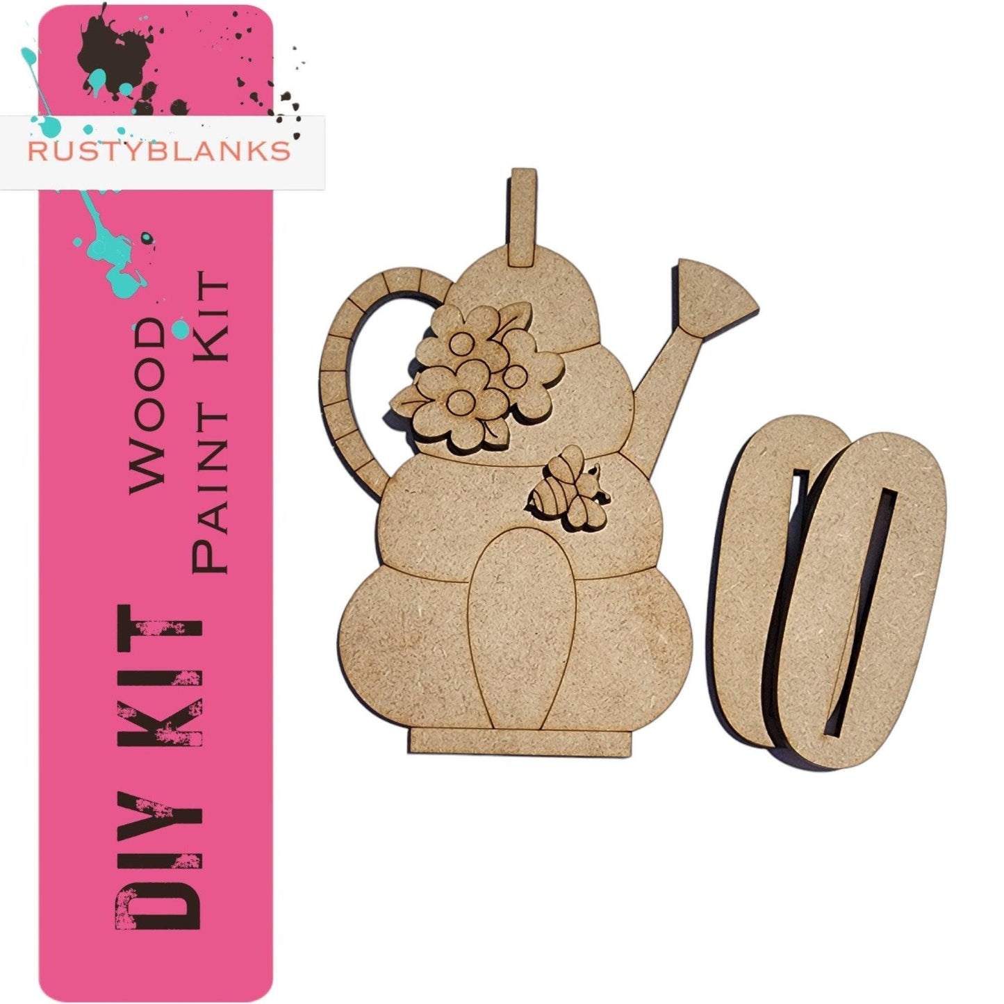 a wooden cutout of a teapot with flowers