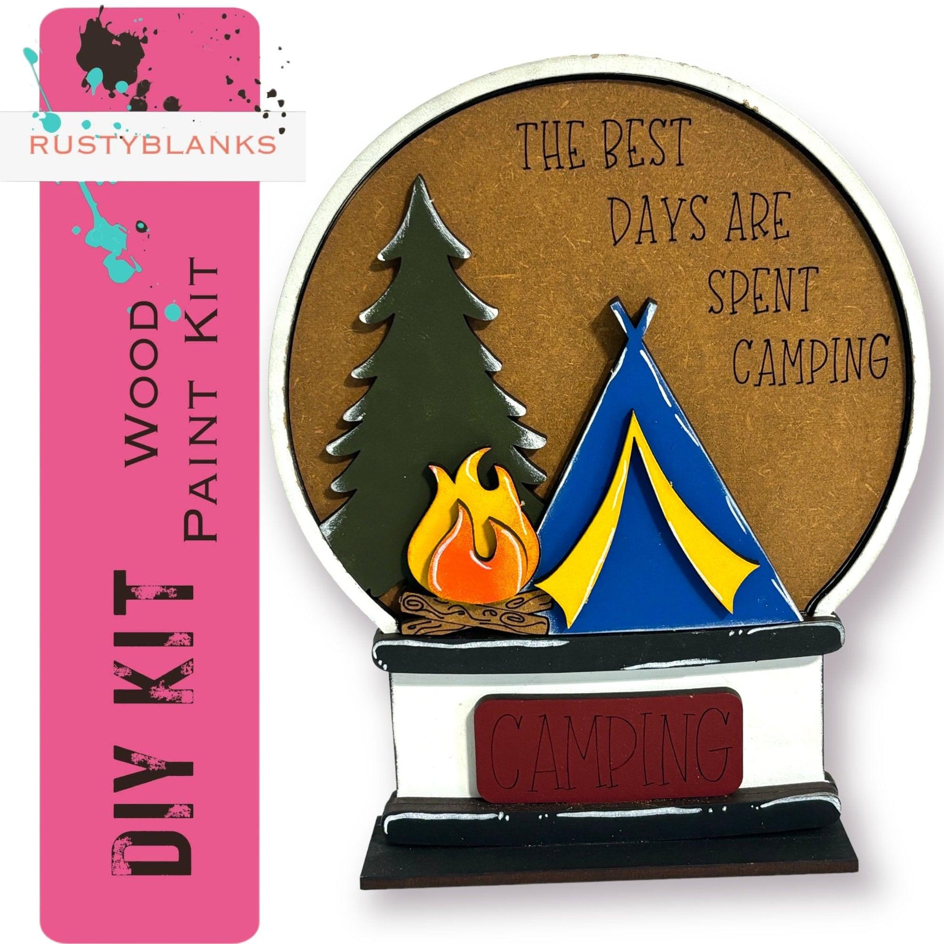 a wooden plaque with a campfire and a tent