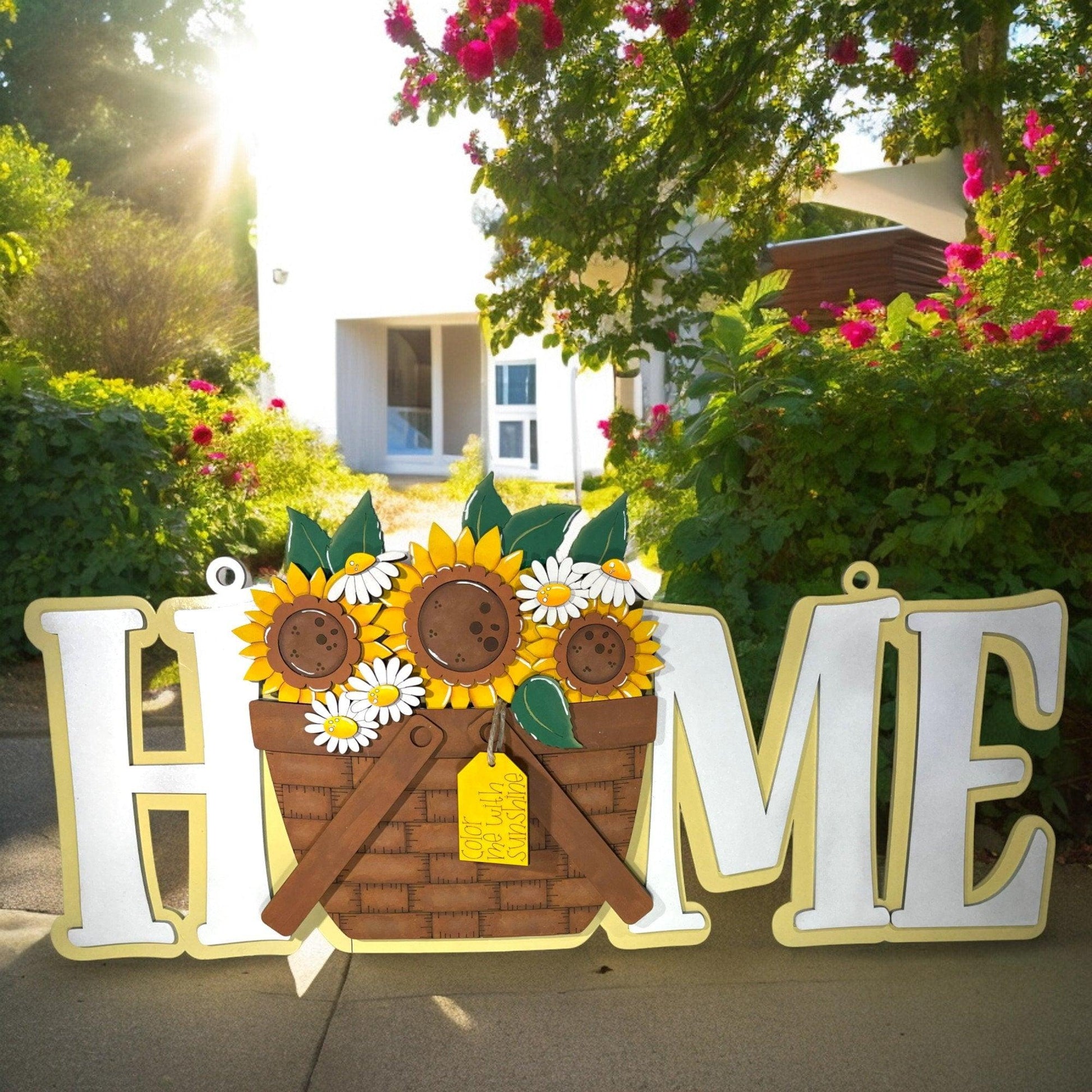 a sign that says home with sunflowers in a basket