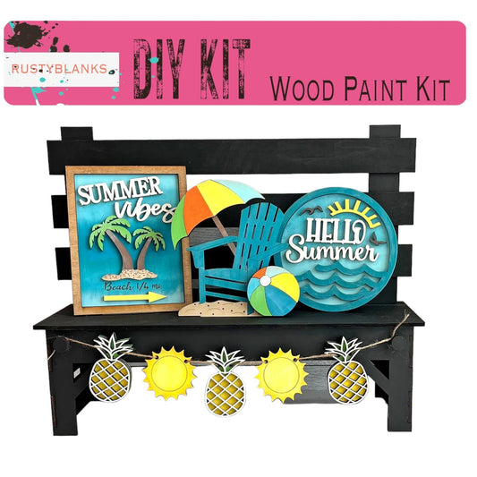 a wooden paint kit with pineapples and a beach ball