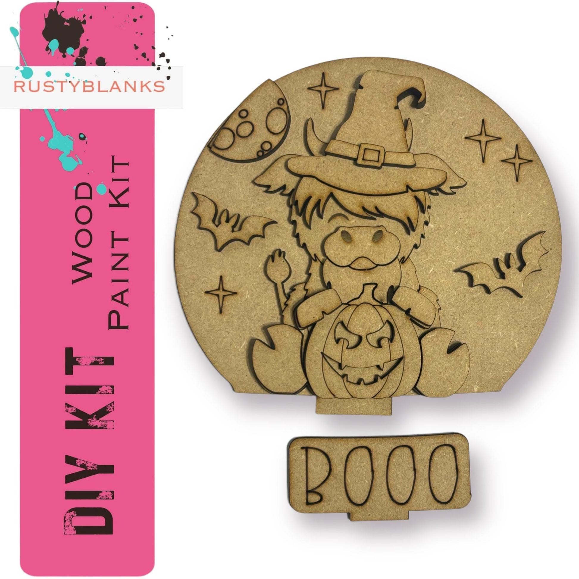 a wooden stamp with a drawing of a witch holding a pumpkin