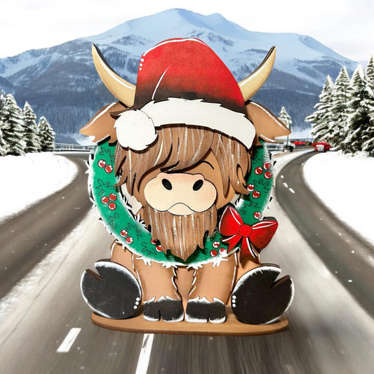 a paper cut out of a horned animal on a road