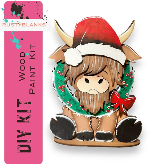 a wooden cutout of a yak wearing a christmas wreath