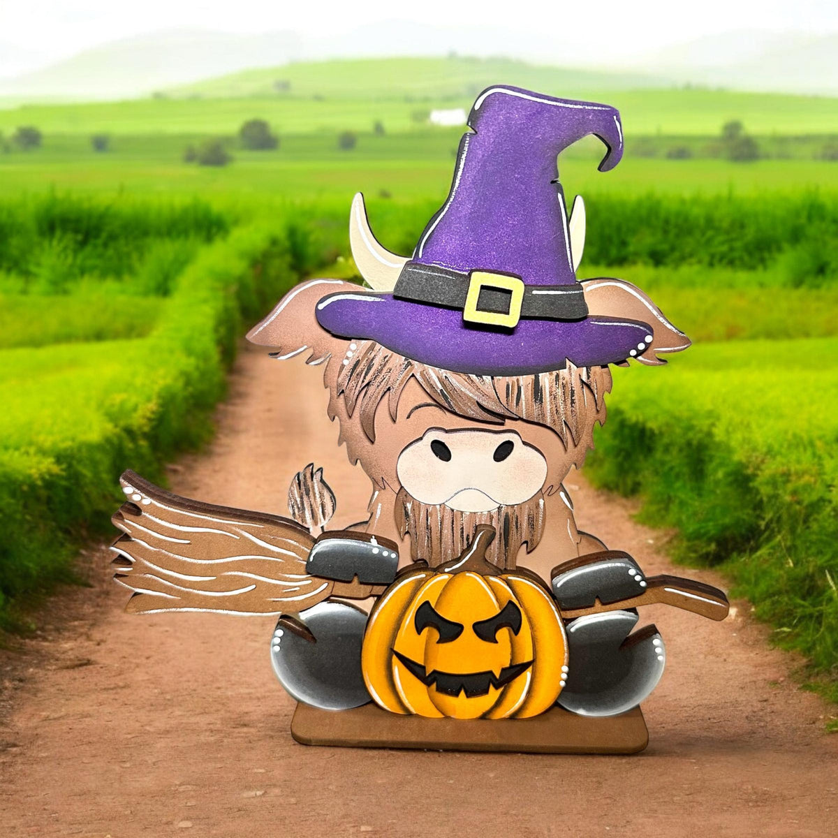 a paper cut out of a scarecrow holding a jack - o'- lantern