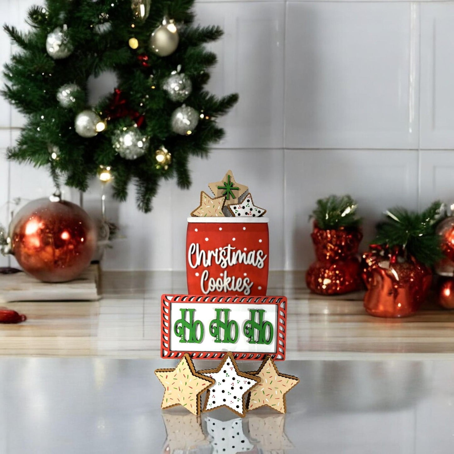 a stack of christmas cookies sitting on top of a counter