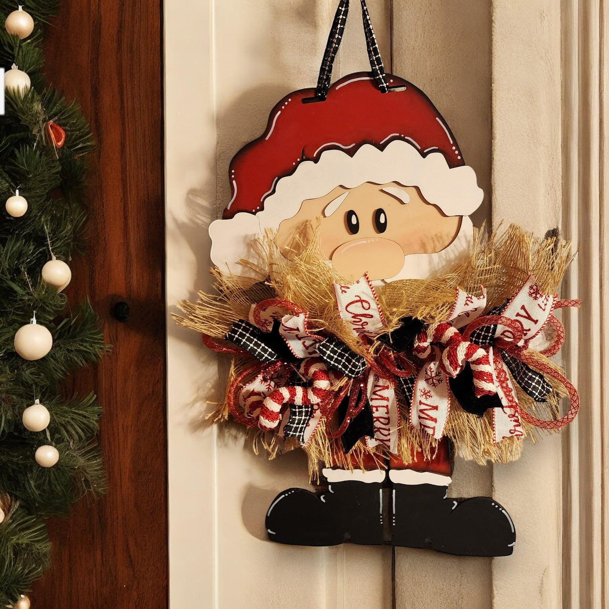 a christmas decoration hanging on a door