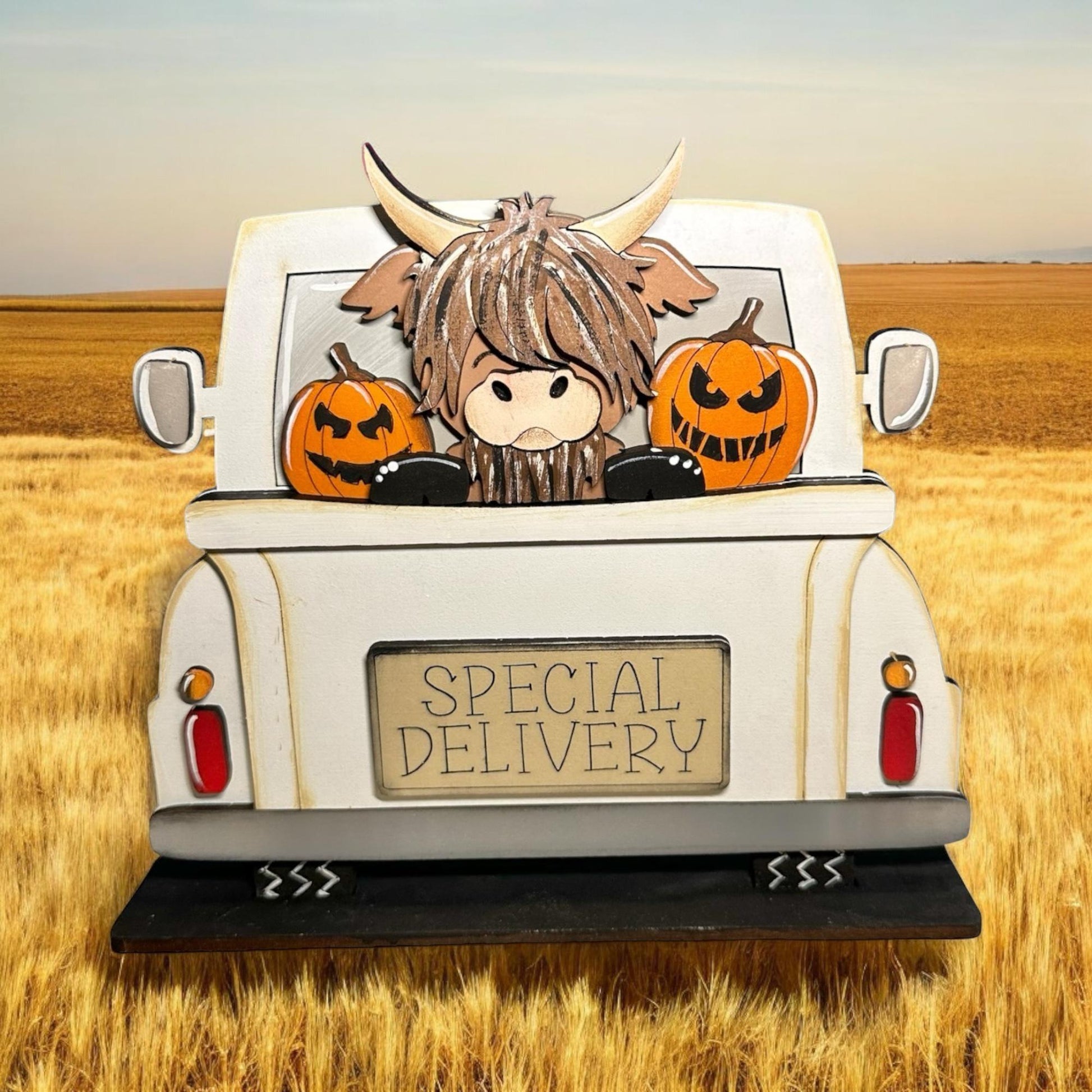 a truck with pumpkins in the back of it