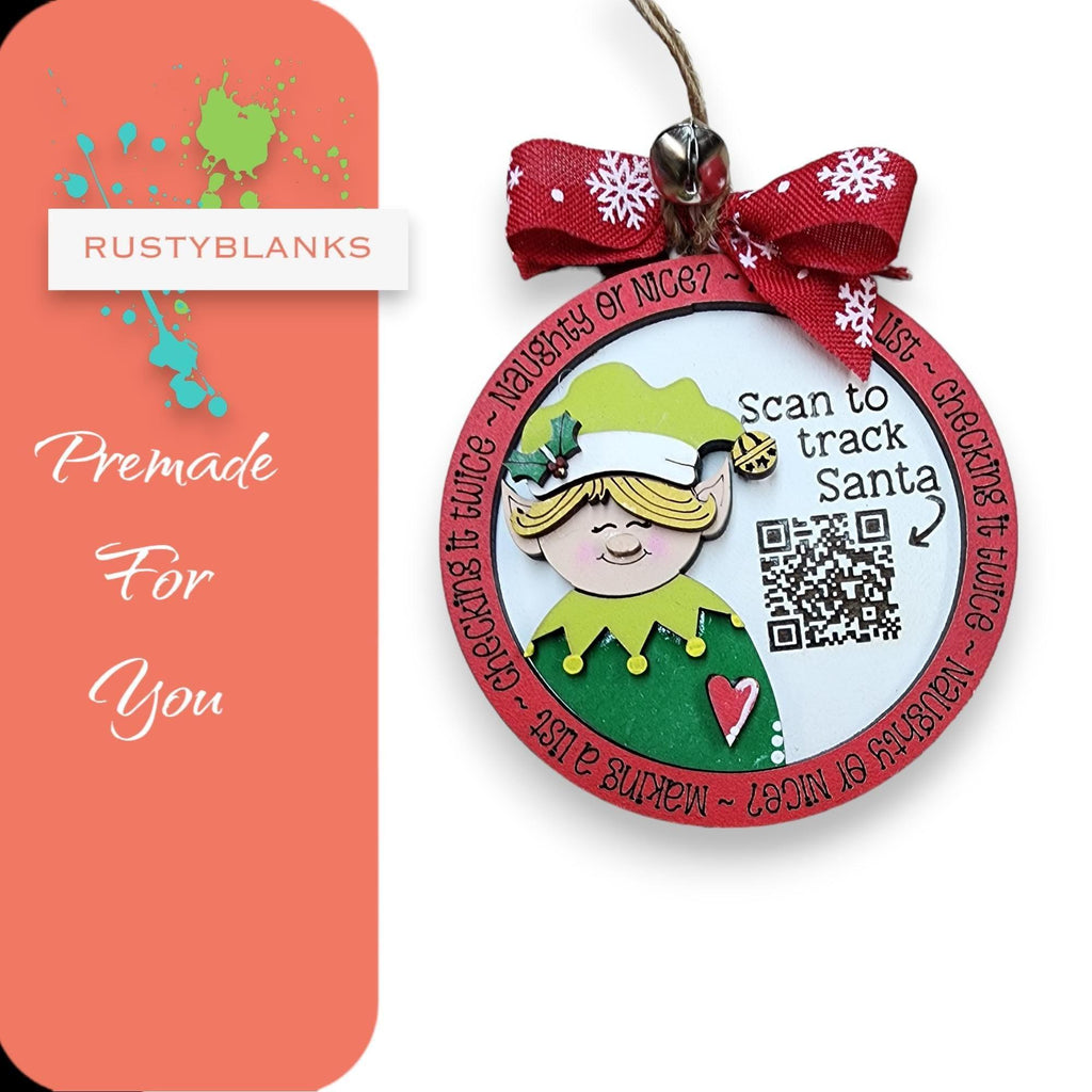 a pink and green christmas ornament with a pink bow