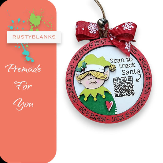 a pink and green christmas ornament with a pink bow