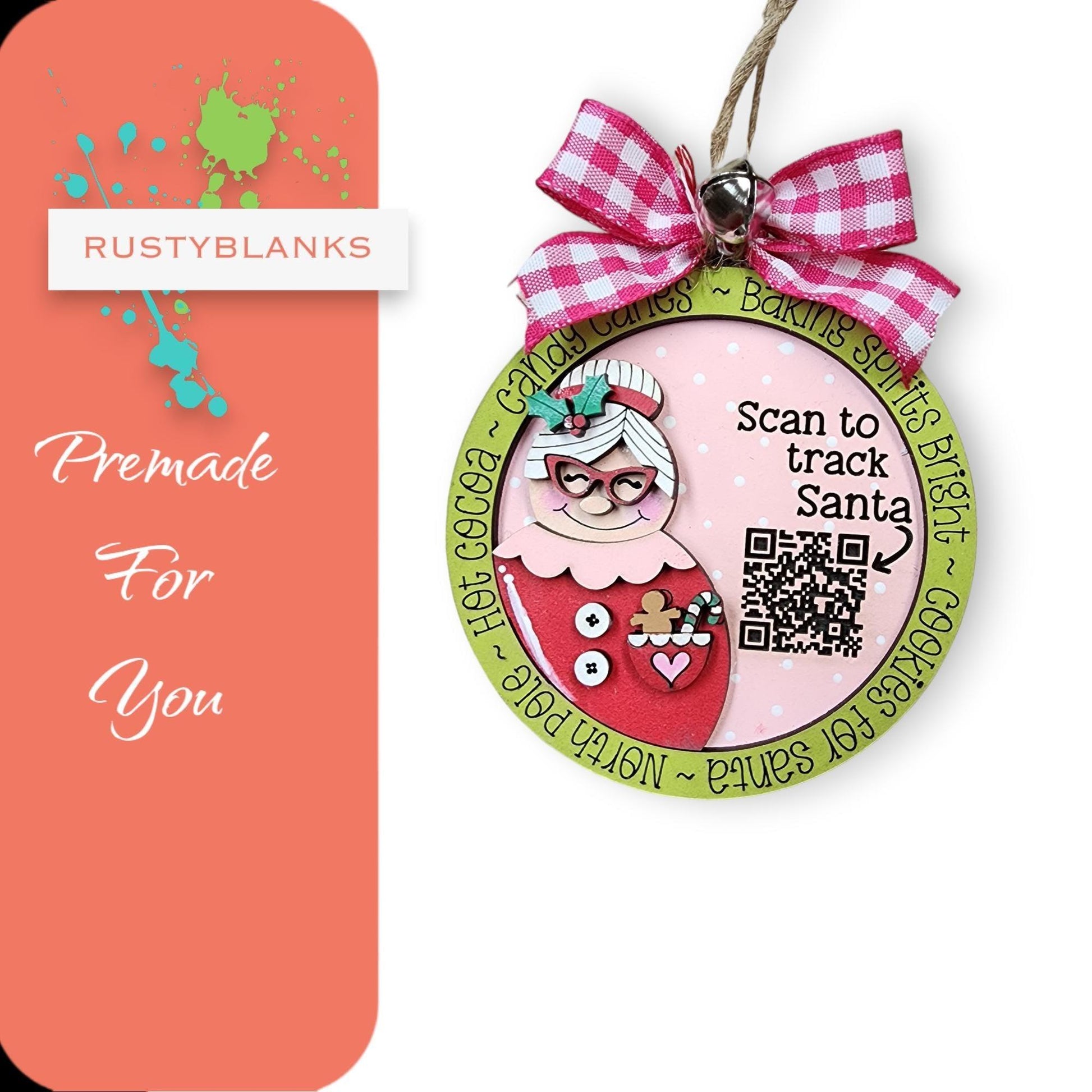 a pink and green christmas ornament with a pink bow